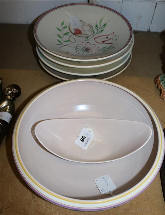 Four Poole Pottery floral-design large shallow bowls, a fruit bowl and a shaped oval bowl (6)